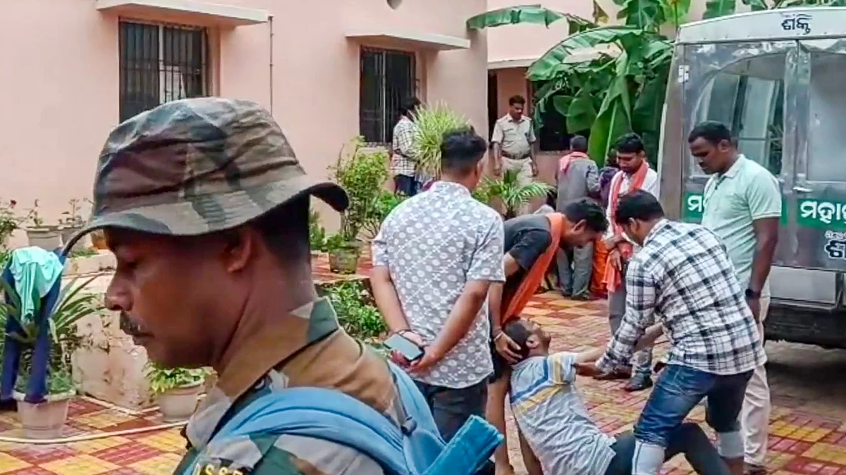 Family members of a victim mourn at a hospital in Puri on 29 June (photo: PTI)