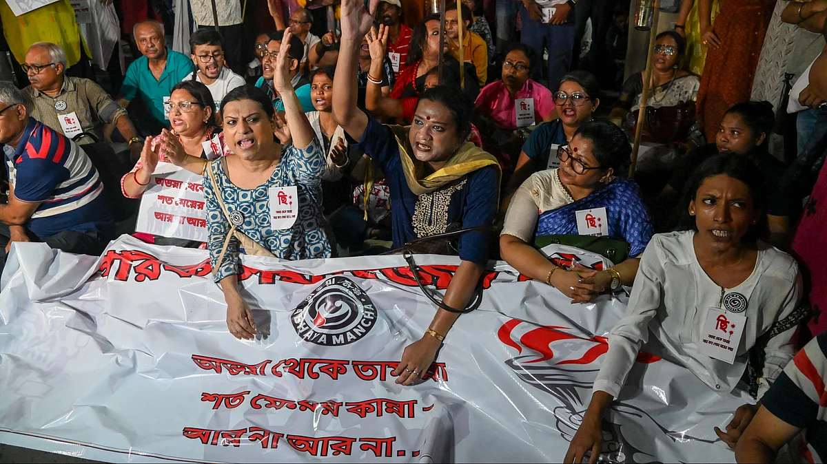People raise slogans during a protest in Kolkata on 29 June (photo: PTI)