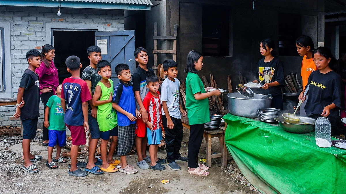 Children in a queue at a relief camp in Rengkia village in June 2023 (file photo)