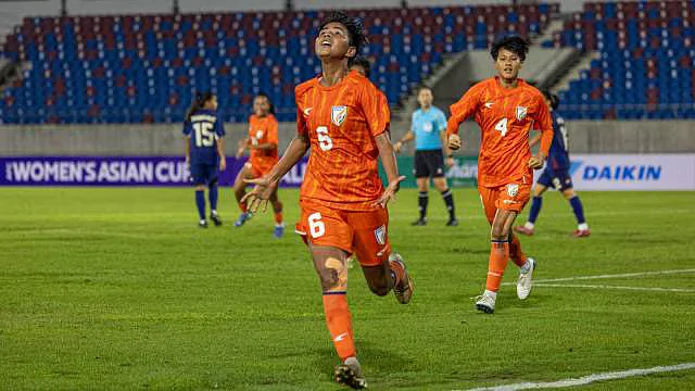 Sangita Basfore celebrates one of her two goals during their famous win against Thailand