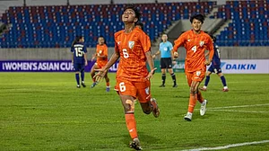 Sangita Basfore celebrates one of her two goals during their famous win against Thailand