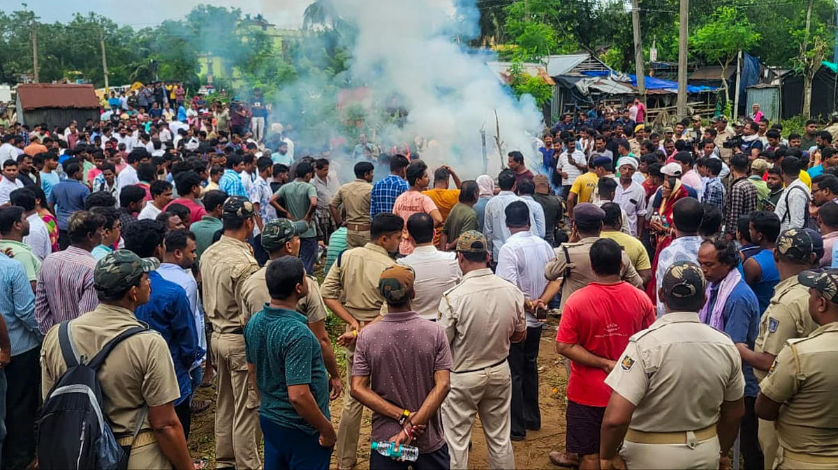 Police personnel stand guard in Balasore district on 15 July (photo: PTI)