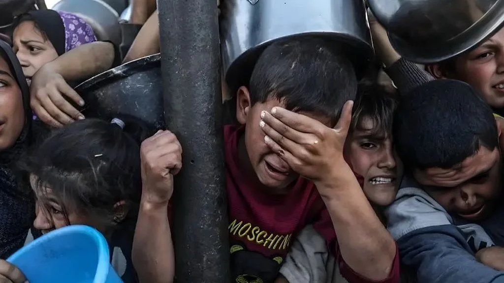 In Gaza, children cry in pain and desperation in the crush to get food