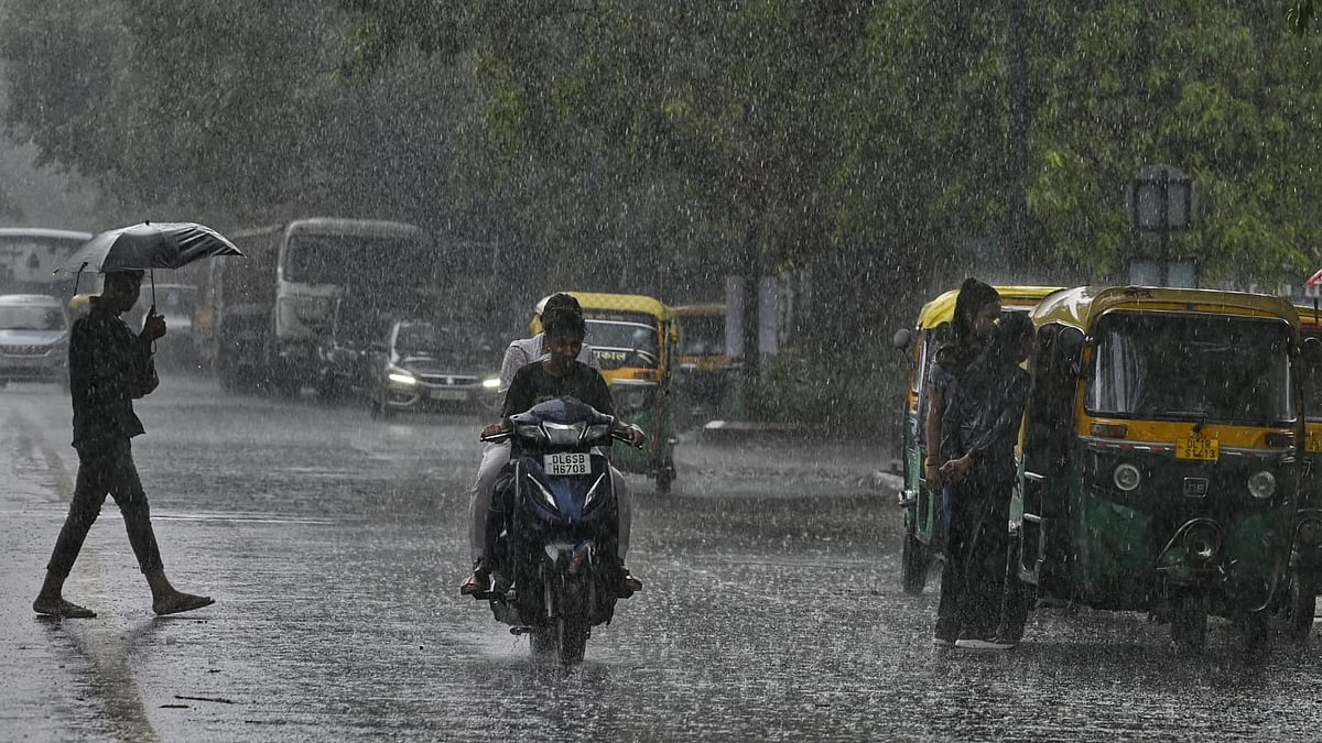 Caught in heavy showers in Delhi on Friday. (Photo: Vipin Kumar)