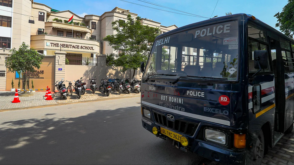 A police van parked outside The Heritage School at Rohini on 18 July (photo: PTI)