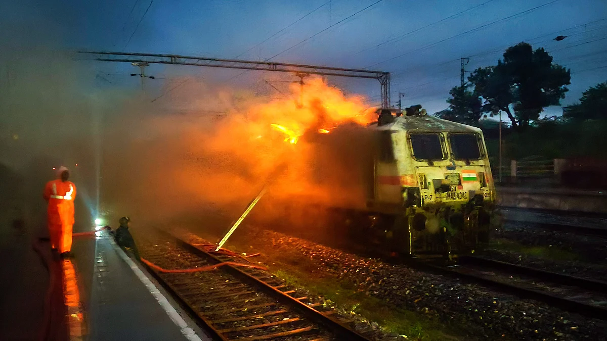 Firefighters try to douse the flames in the engine of the Garib Rath Express (photo: PTI)