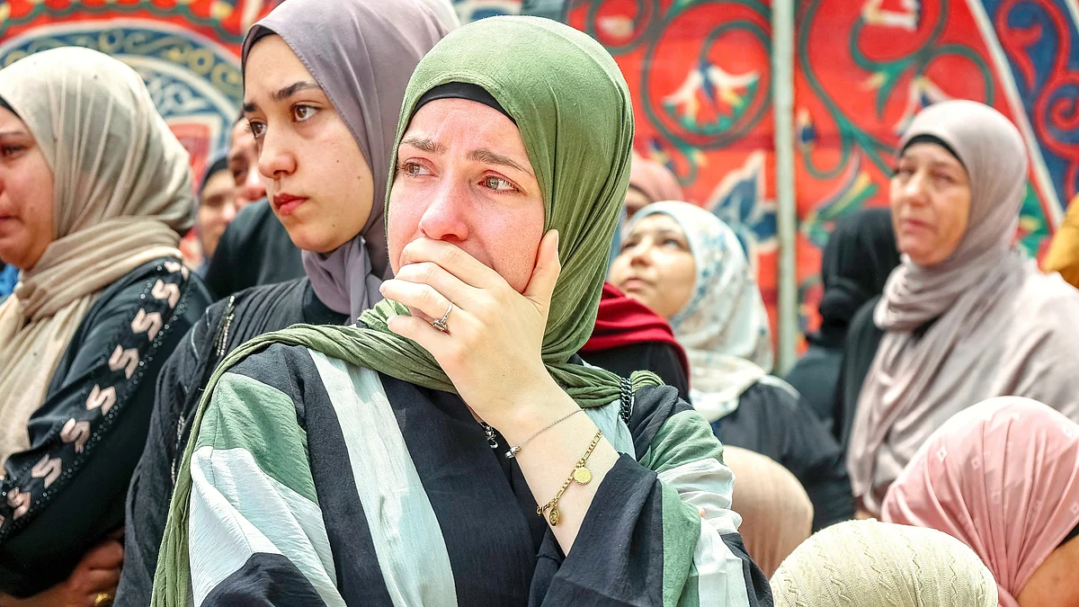Palestinian women mourn the dead in Ramallah in occupied West Bank, 13 July