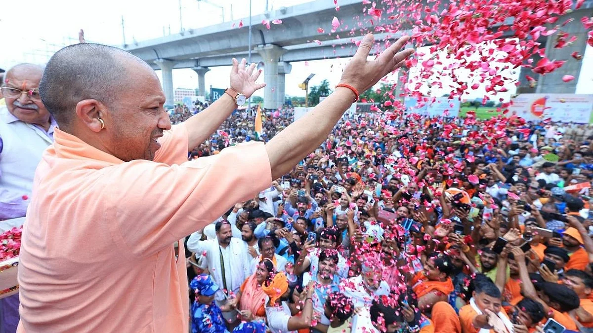 Uttar Pradesh CM Yogi Adityanath showers flowers on kanwariyas in Meerut
