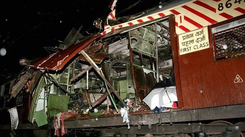Mangled remains of the Mumbai local train (photo courtesy: @amitsurg/X)
