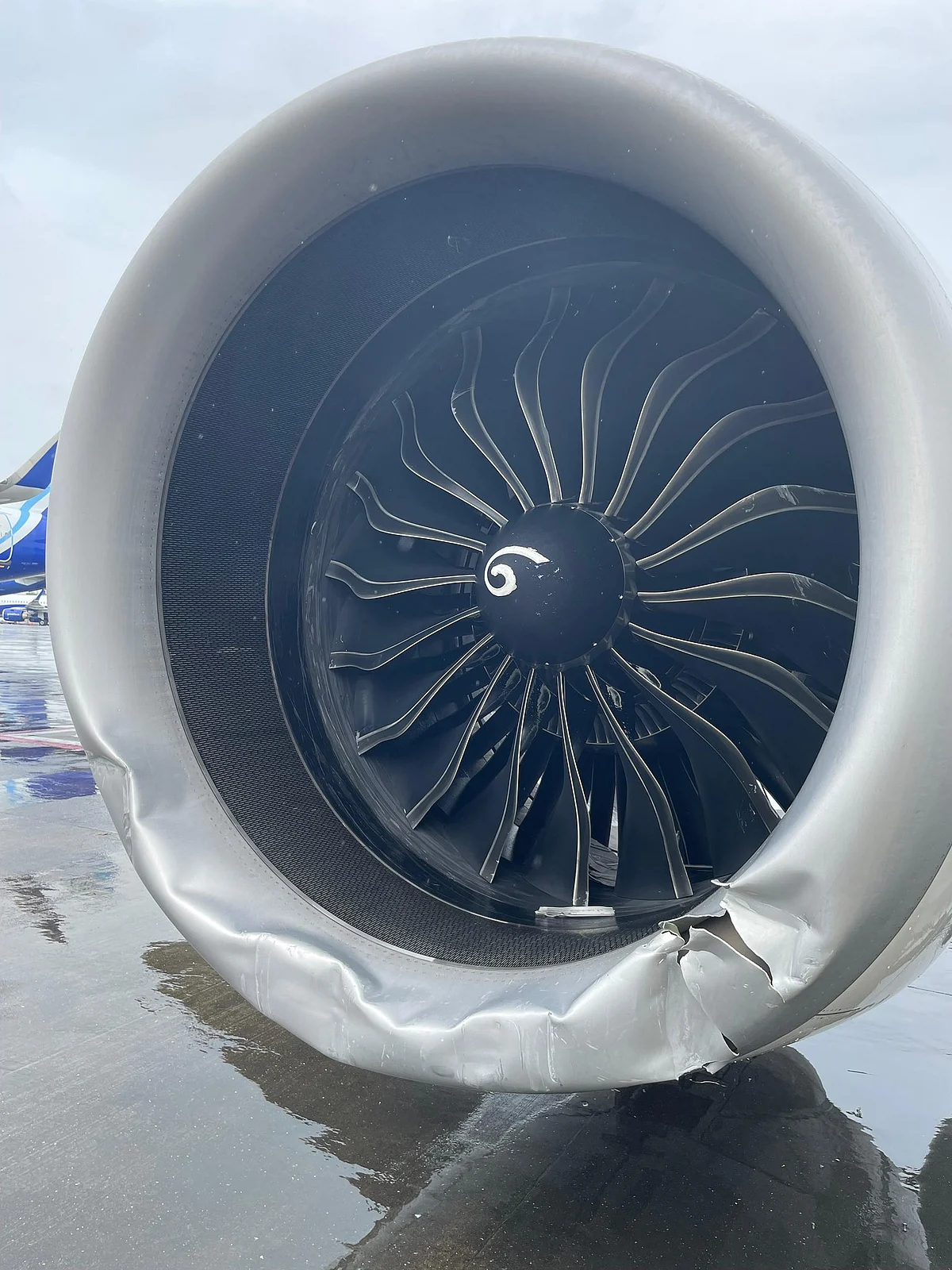 The damaged engine cowl (photo courtesy: CSMIA)