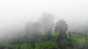Clouds descend on the hills in Rajouri (photo: PTI)