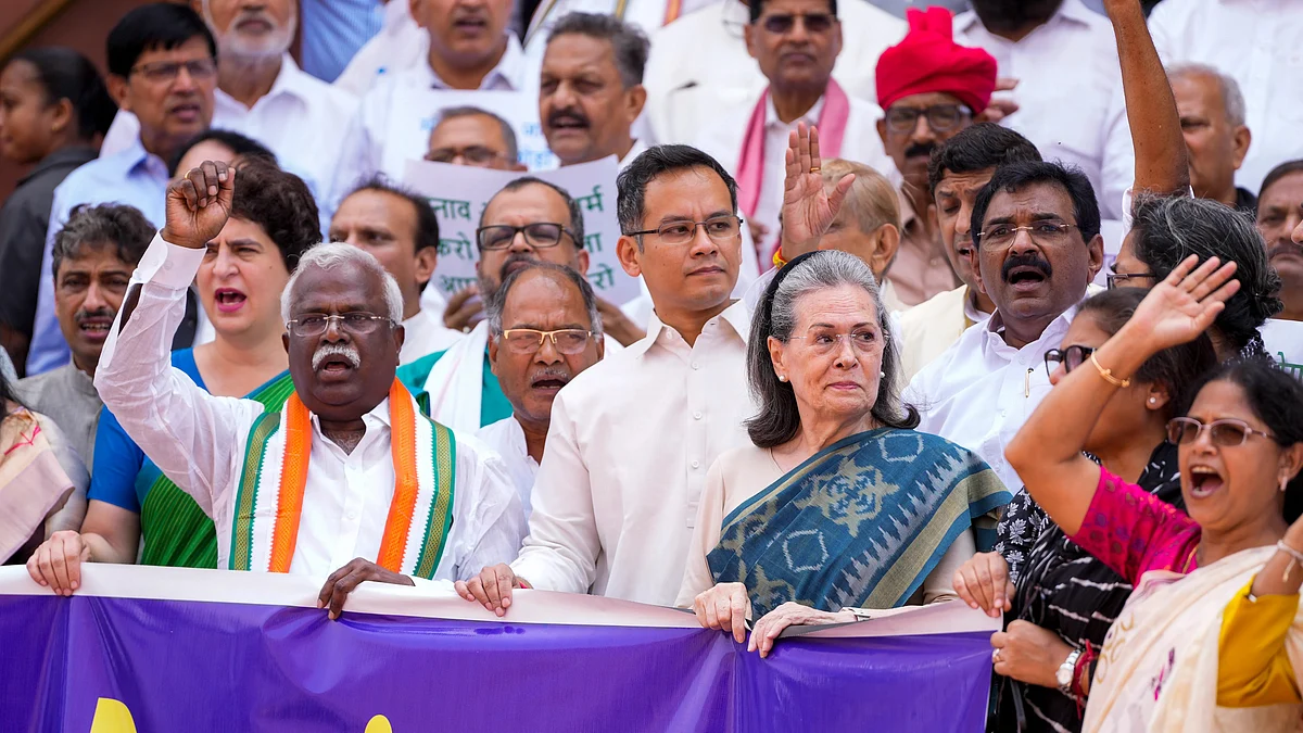 Sonia Gandhi with other Opposition MPs protest during Monsoon session on 24 July (photo: PTI)