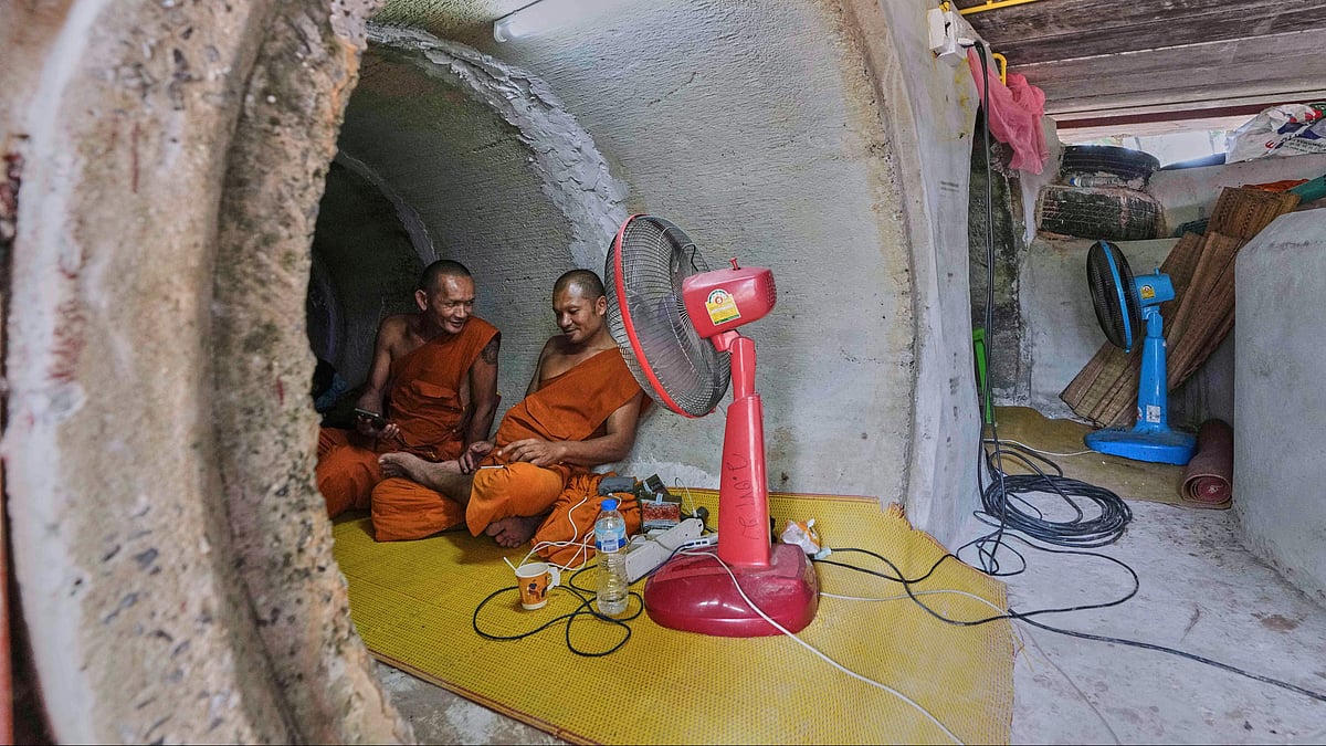 Thai Buddhist monks take shelter in Surin province, Thailand on 26 July (photo: AP/PTI)