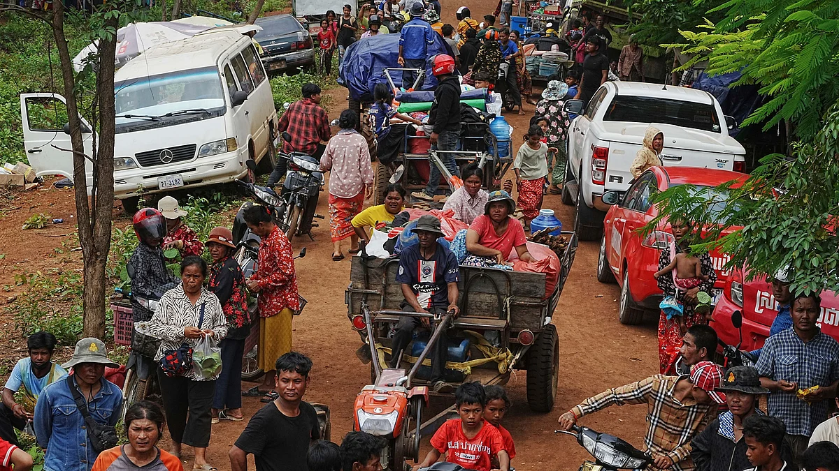 Cambodian villagers wait to receive drinking water in Oddar Meanchey province on 26 July (photo: AP/PTI)