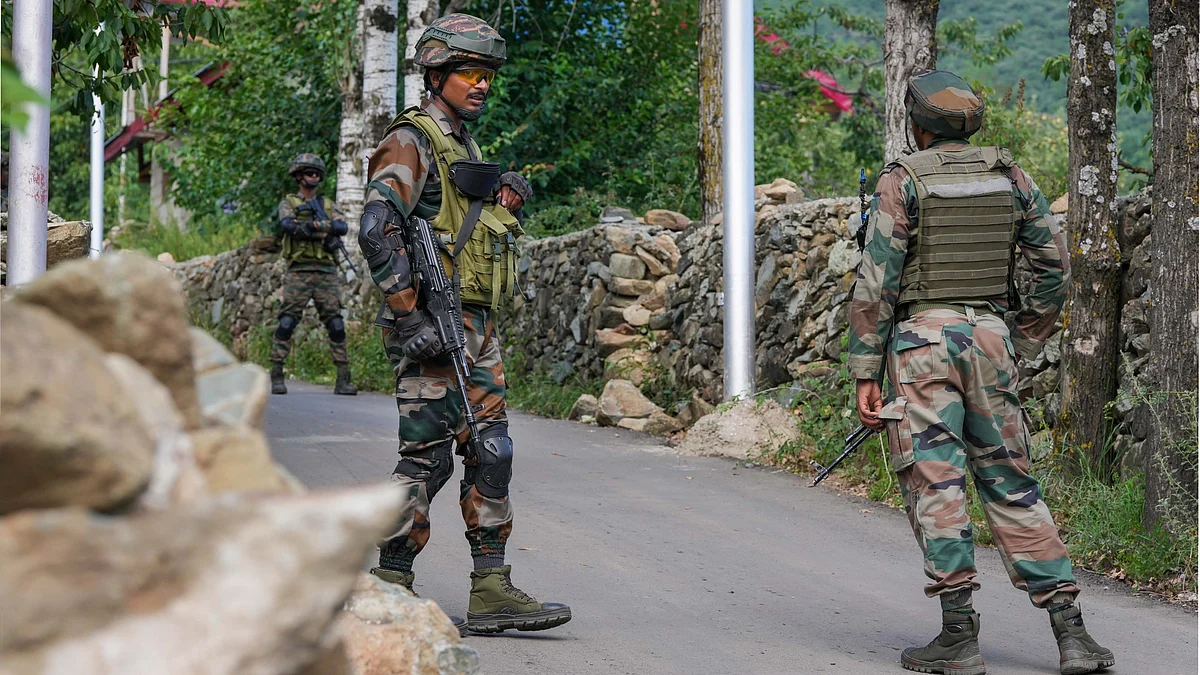 Security personnel conducting a search operation, near Dachigam in Srinagar. (photo: PTI)