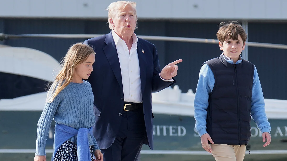 Donald Trump walks with his grandchildren at RAF Lossiemouth on 29 July (photo: AP/PTI)