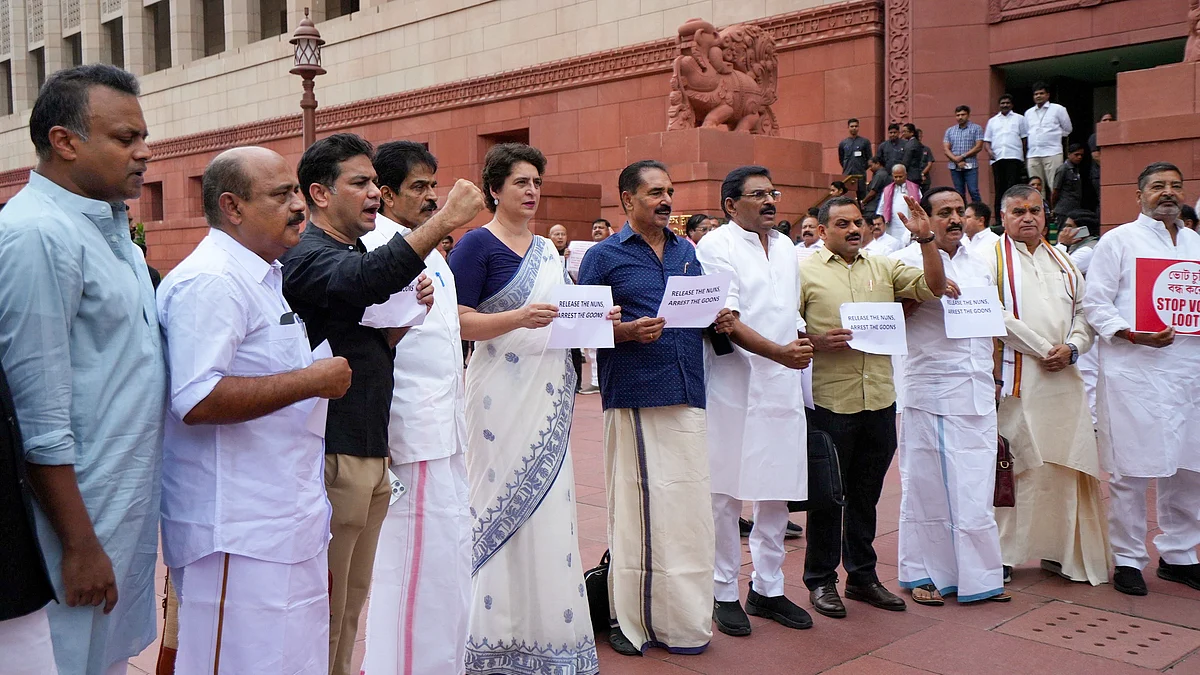 Priyanka Gandhi Vadra with others stage a protest in New Delhi on 30 July (photo: PTI)