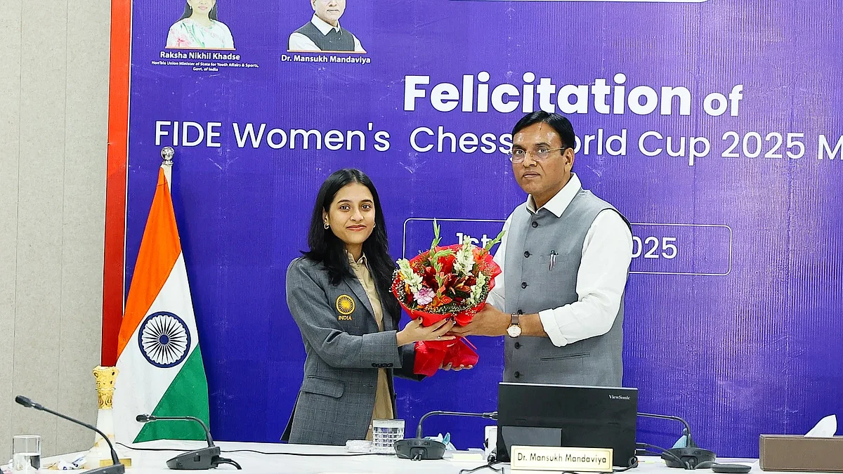 Divya Deshmukh being greeted by Union sports minister, Dr Mansukh Mandaviya, in Delhi