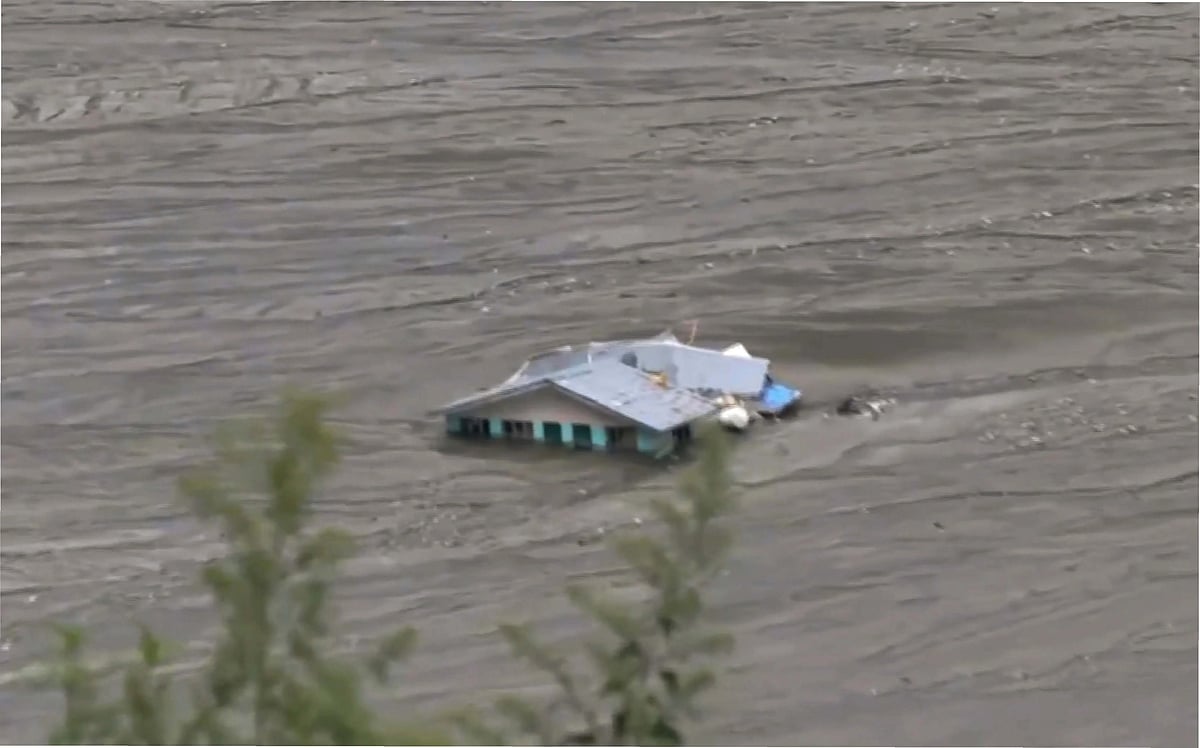 A partially submerged house at Dharali. (photo: PTI)