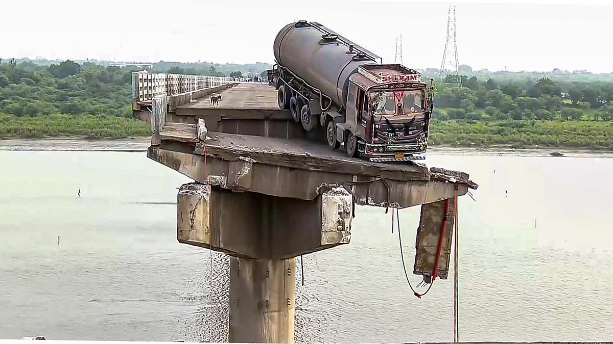 Narrow escape: The collapsed bridge across Mahisagar in Vadodara. (Photo: PTI)