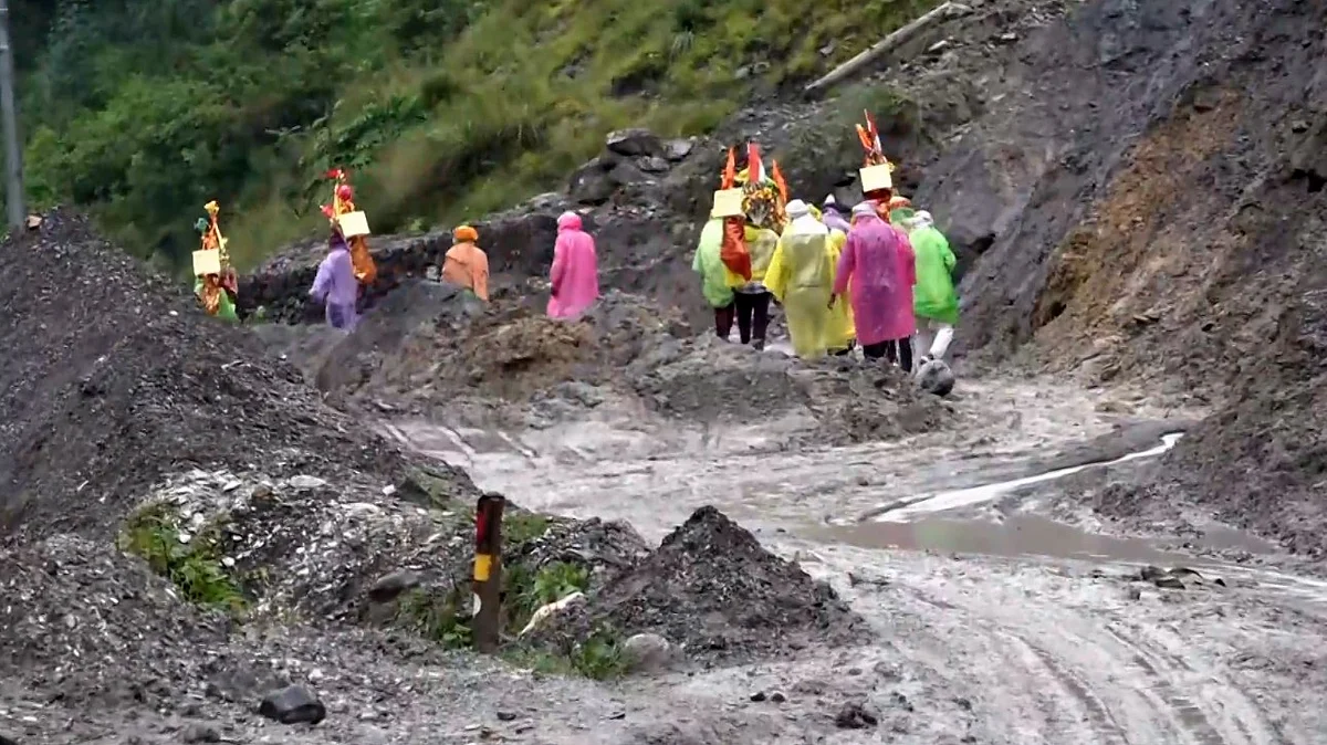 Villagers at flash flood-hit Dharali area in Uttarkashi on 6 August (photo: PTI)