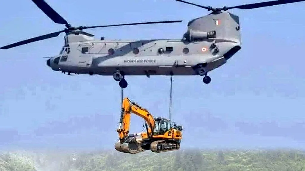 An IAF chopper carries heavy equipment during a sortie in Uttarkashi (photo courtesy: @Ananth_IRAS/X)