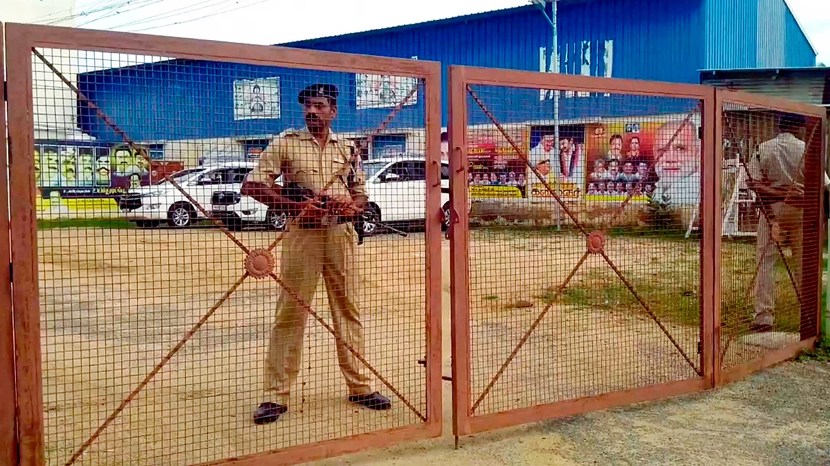 Security personnel stand guard during ED raids on premises linked to DMK leader Periyasamy