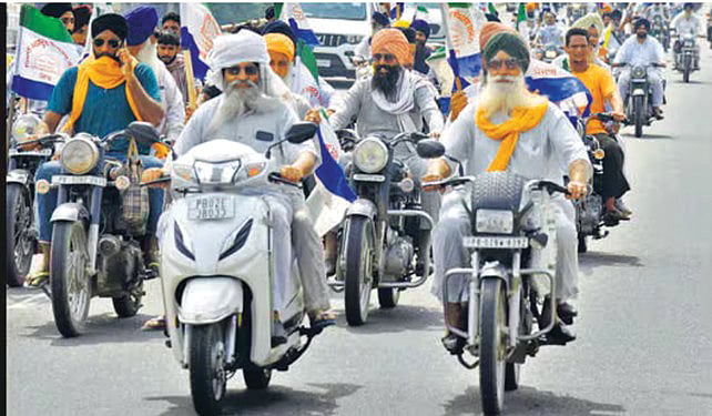 Farmers protesting the proposed land pooling policy
