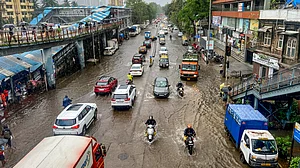 Mumbai reels under heavy rains for third day; IMD issues red alert