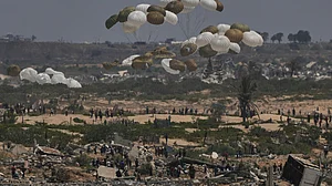 An aerial aid drop into the ruins of Gaza, a small, expensive 'drop' in a food desert