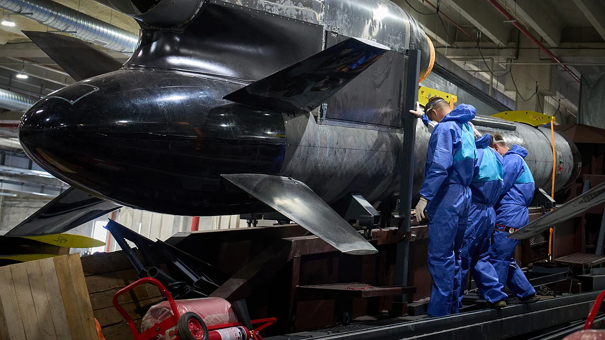 Workers inspect a Flamingo cruise missile in Ukraine