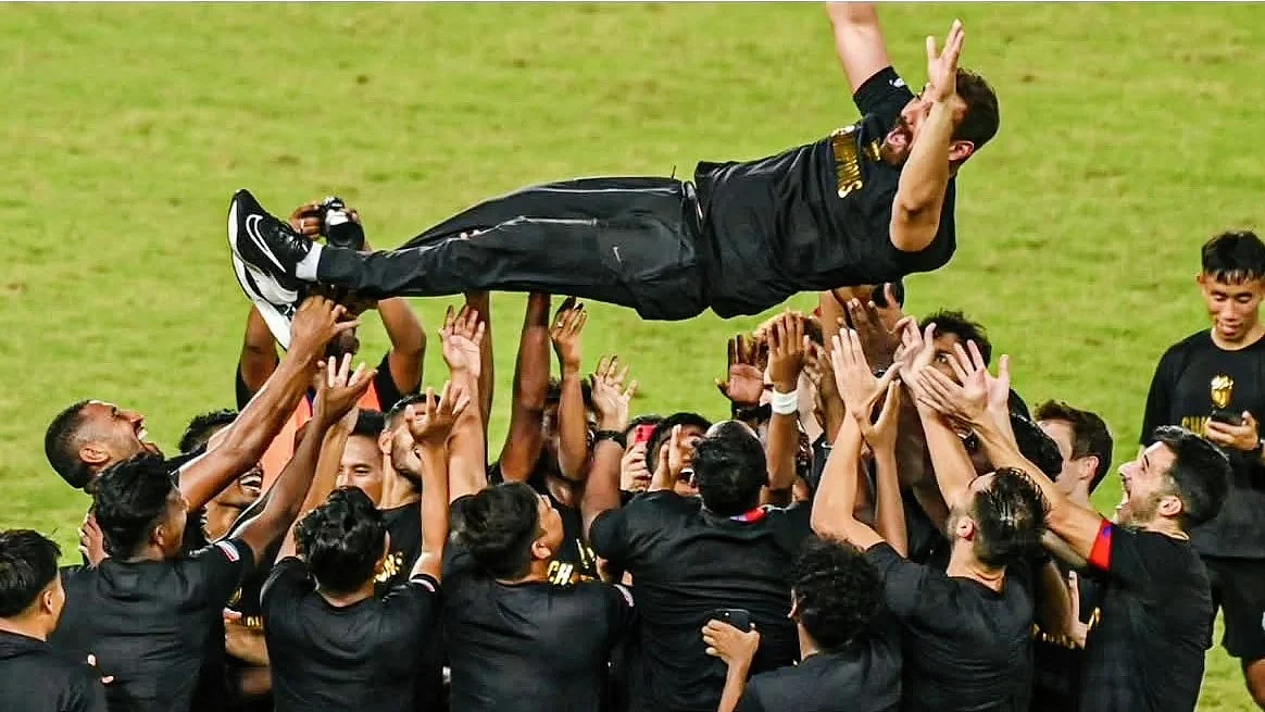 On cloud nine: John Abraham given a victory bump by NUFC players on Saturday