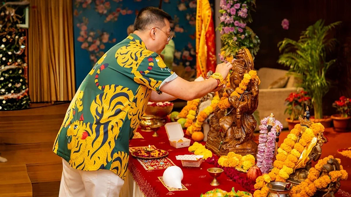 Singapore high commissioner in India Simon Wong has a modak and a tilak for Ganapati Bappa