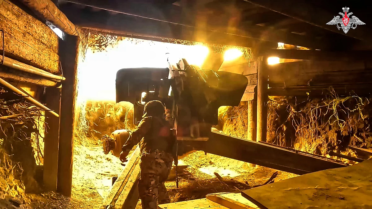 A Russian soldier fires a 152 mm howitzer 2A65 Msta-B towards Ukrainian position