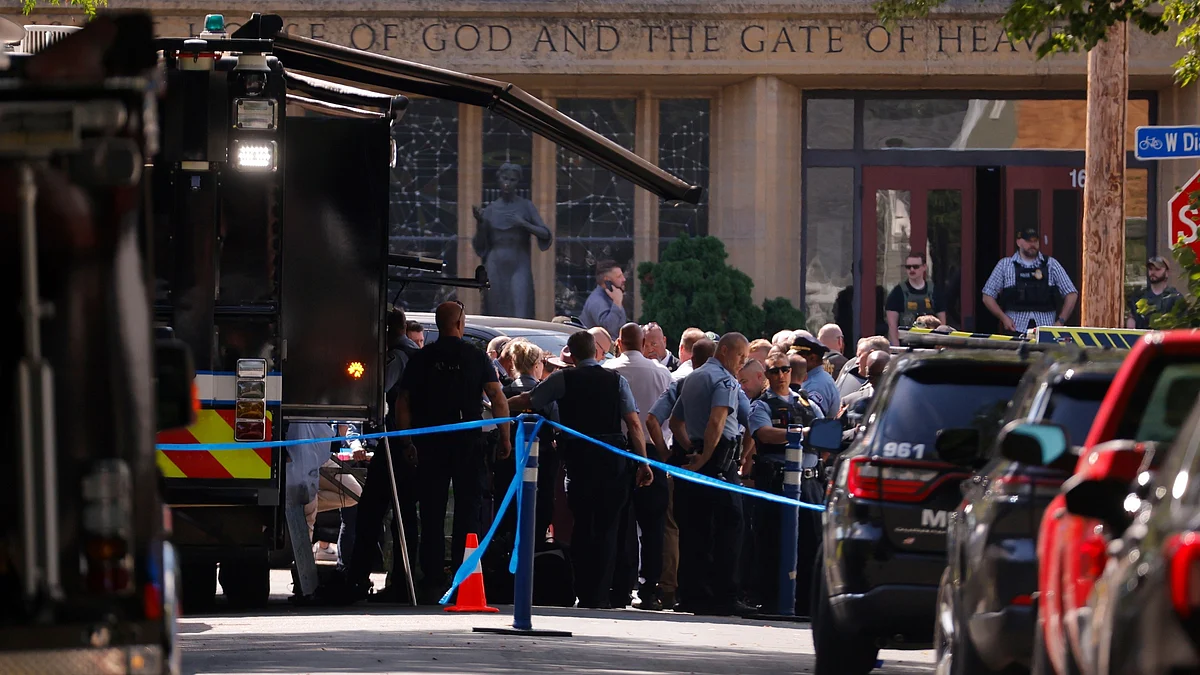 Law enforcement officers gather outside the Annunciation Church in in Minneapolis