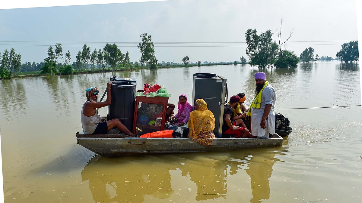 Residents being evacuated with their belongings from Kapurthala. (photo: PTI)