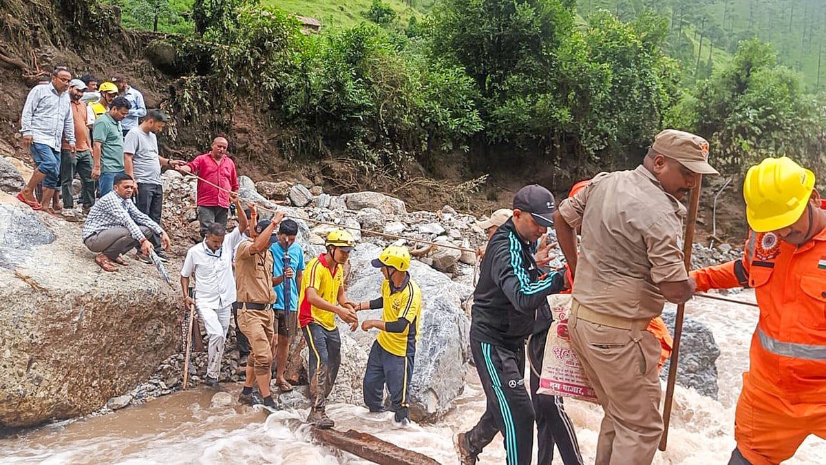 Rescue teams assist locals after a cloudburst in Bageshwar district