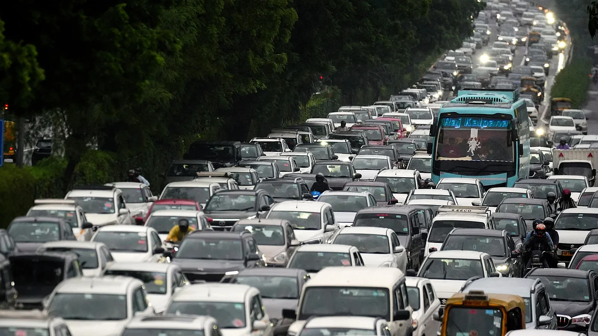 Vehicles stuck in a jam created by rains at Mayur Vihar, New Delhi
