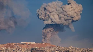 Smoke rises after an Israeli military strike in northern Gaza Strip, as seen from southern Israel, 31 Aug