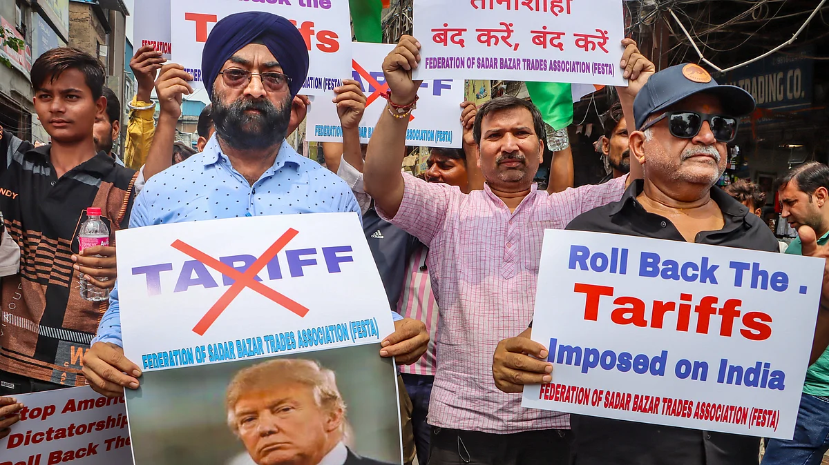 Members of a traders' association protest the recent Trump tariffs in New Delhi, 30 Aug