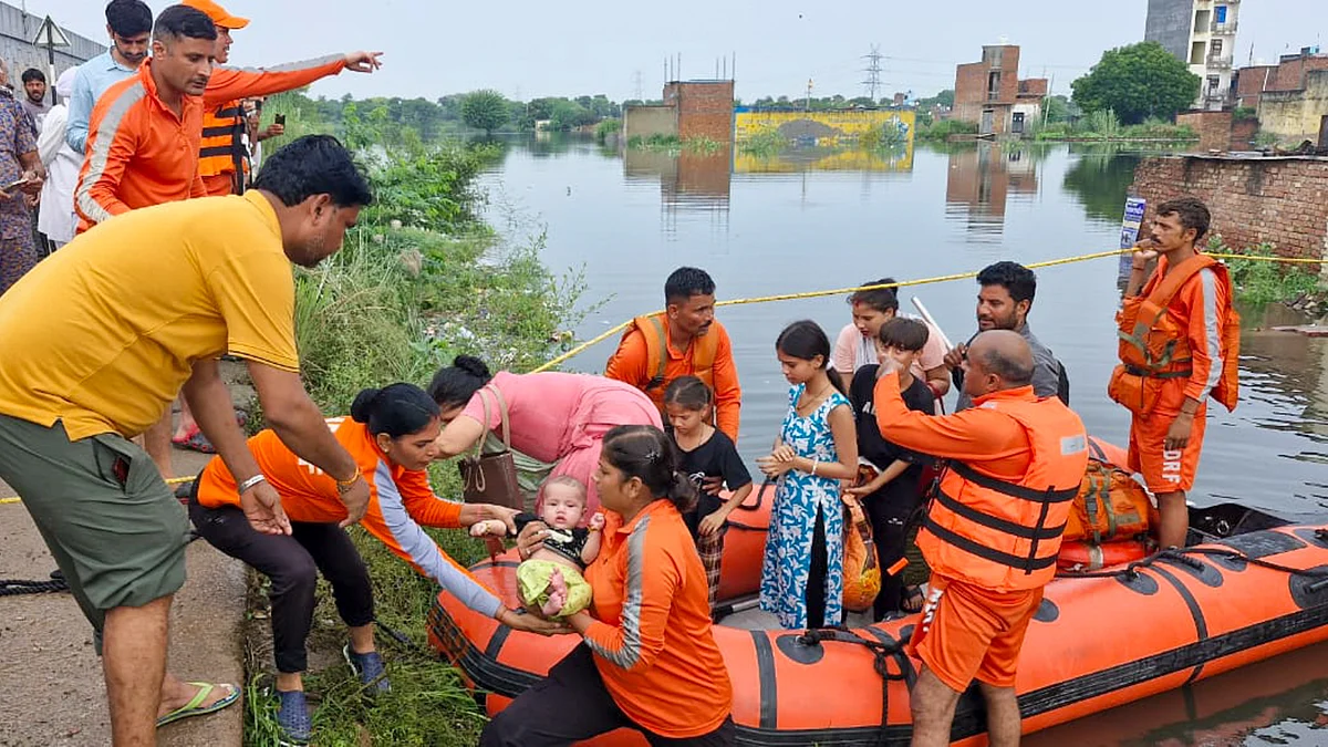NDRF personnel evacuate residents from inundated areas of Delhi