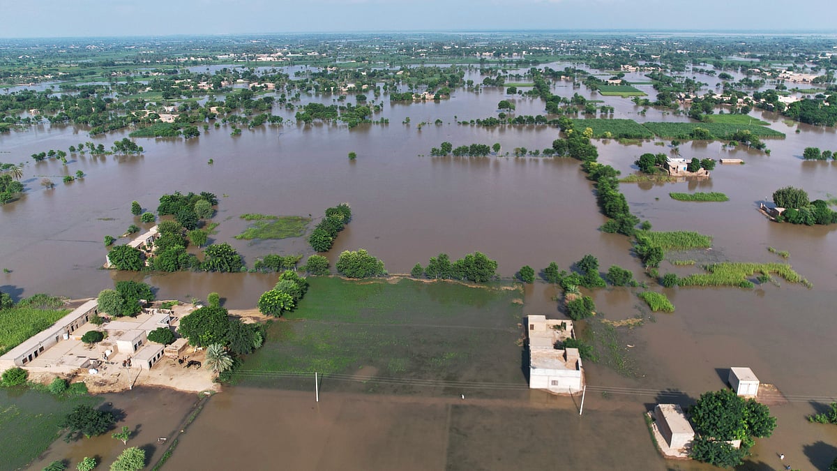 Homes lie partially submerged in floodwaters in Tiba Gheal village, Jhang district