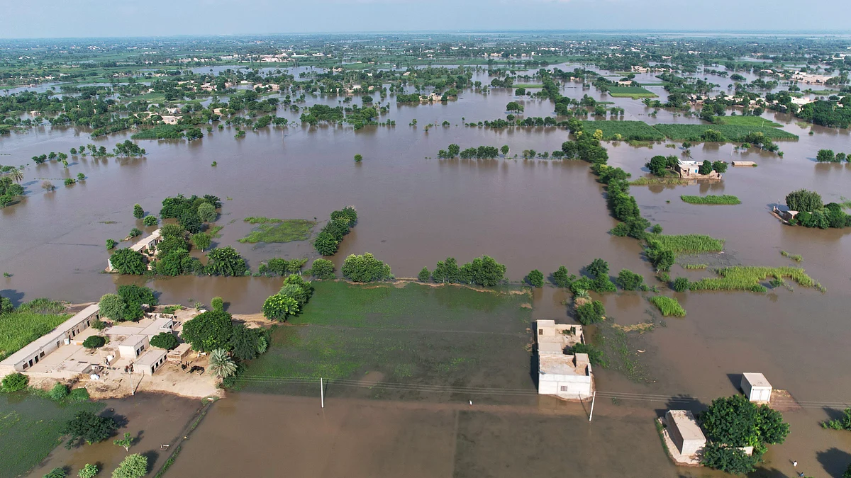Homes lie partially submerged in floodwaters in Tiba Gheal village, Jhang district