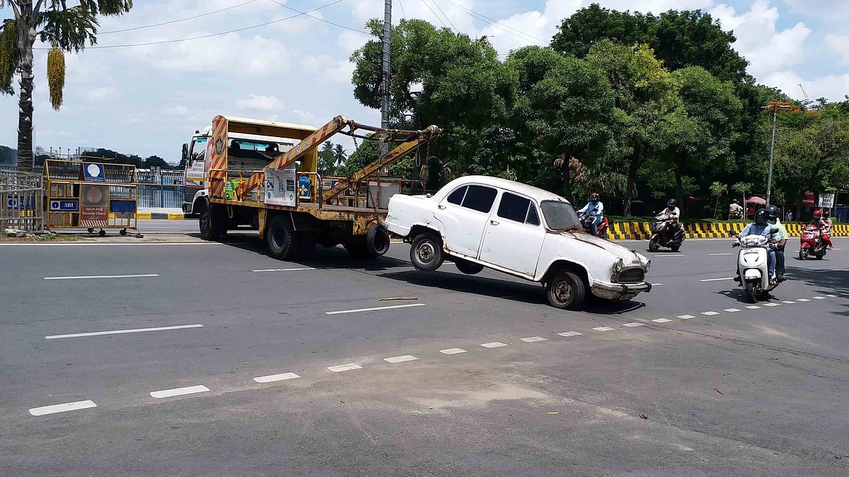 End of the road: A scrapped government vehicle is towed away