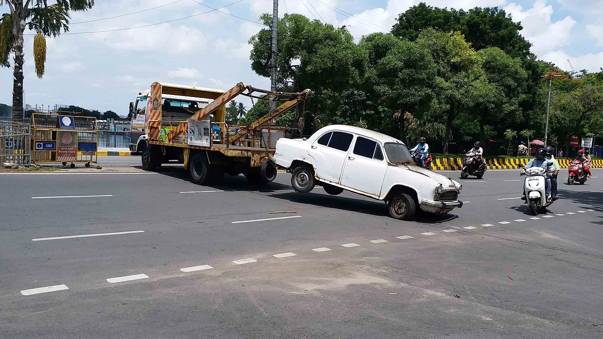 End of the road: A scrapped government vehicle is towed away