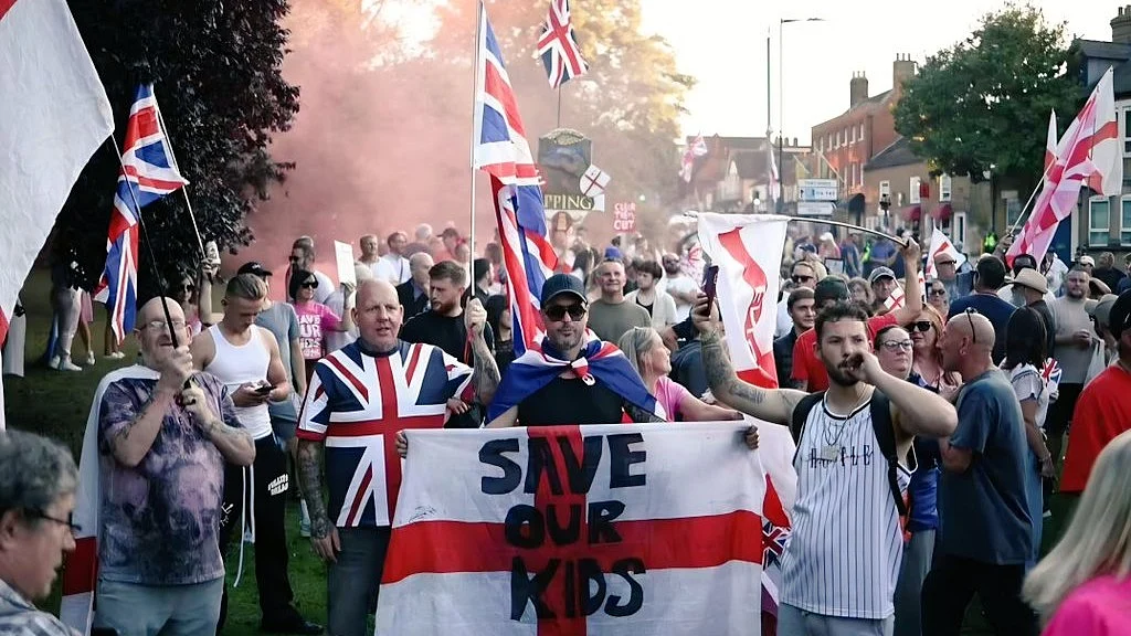 Anti-immigrant demonstrators outside the Bell Hotel in Epping