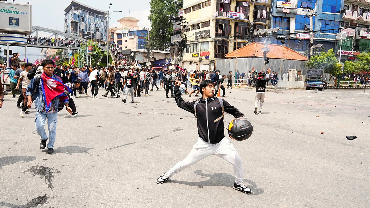 Protestors clash with riot police outside Parliament in Kathmandu, 8 Sept