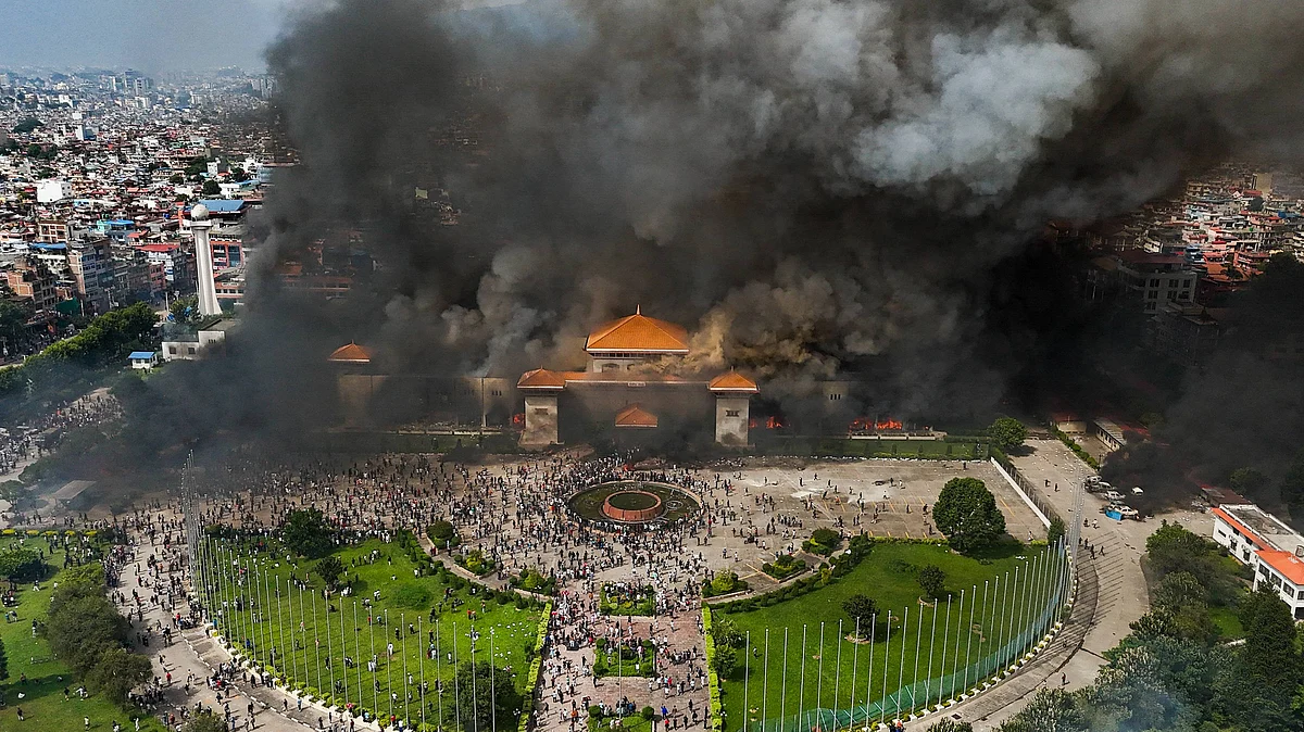 An aerial view of smoke rising from the federal Parliament of Nepal