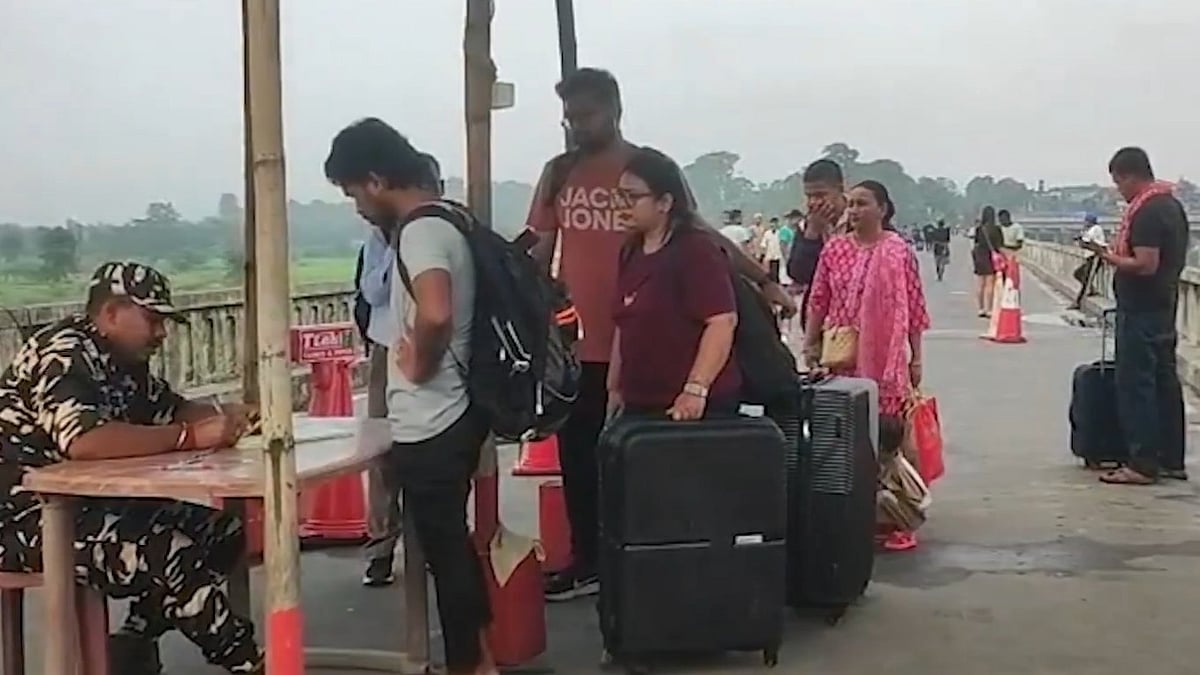 Indians return home via Panitanki border in Siliguri amid unrest in Nepal.
