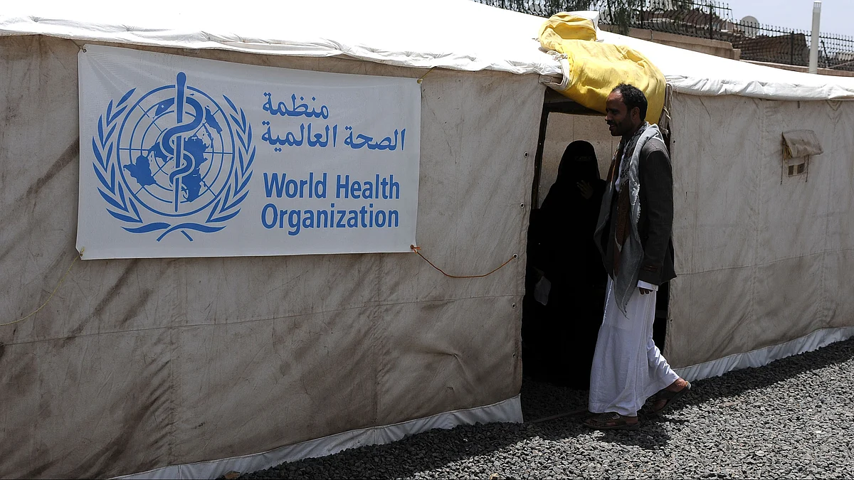 A man enters a tent set up to treat cholera patients in Sanaa.